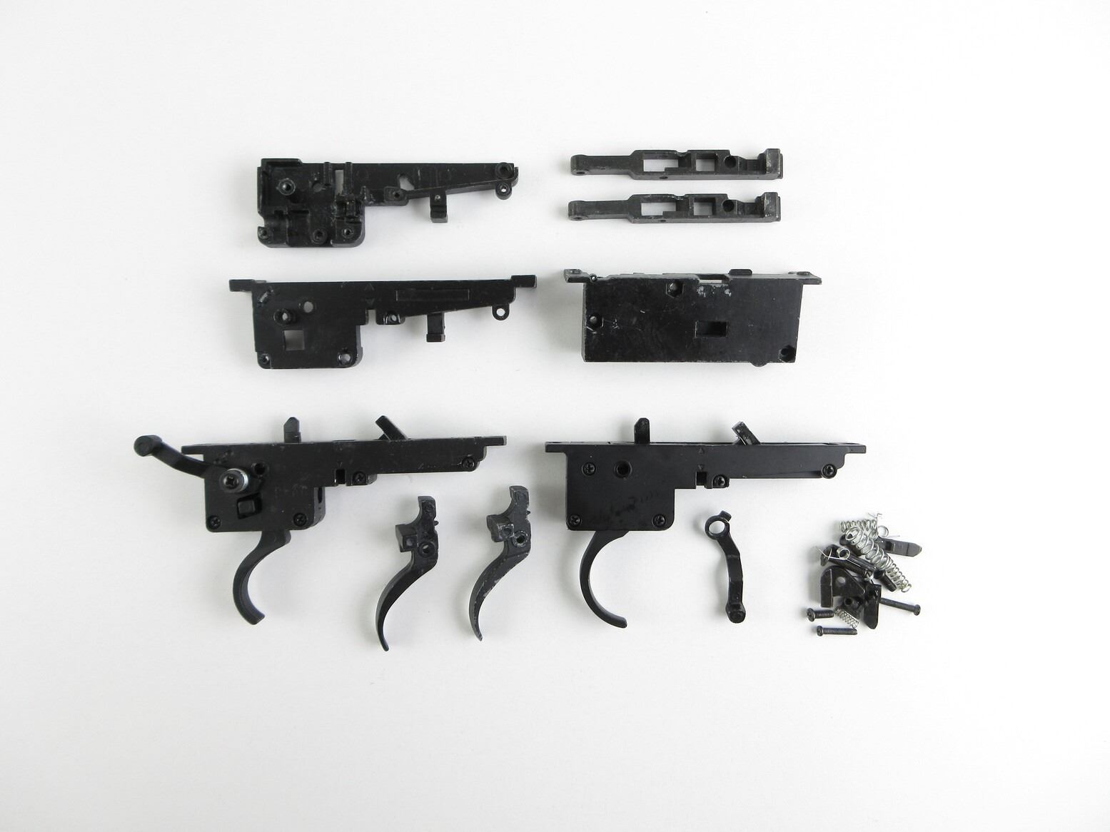 ASSORTED AIRSOFT GUN TRIGGER ASSEMBLIES AND TRIGGER PARTS LOT