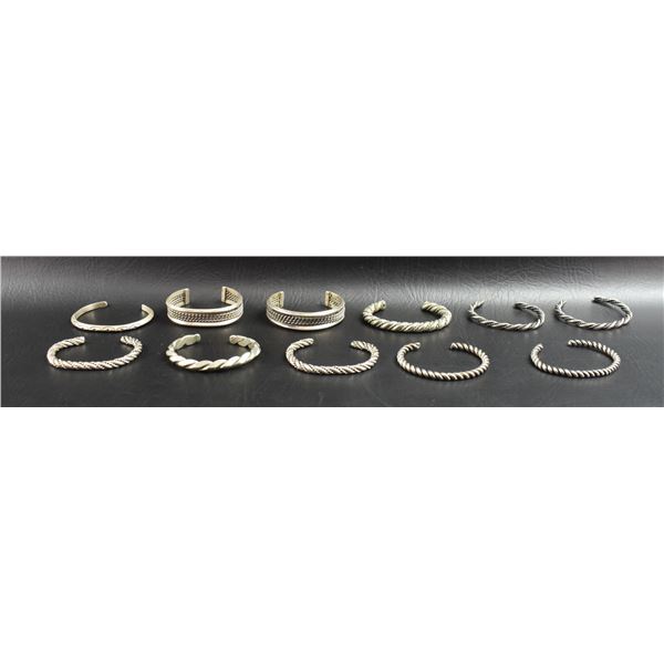 GROUP OF SILVER BRACELETS