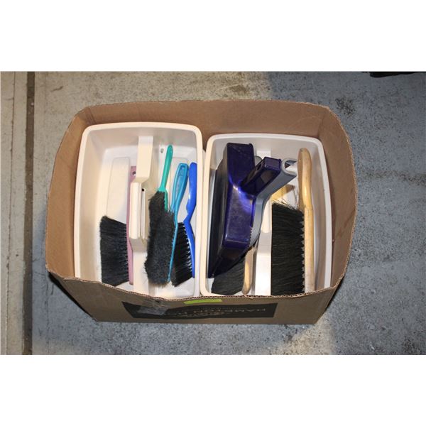 BOX OF CLEANING CADDIES, BRUSHES AND DUST PANS