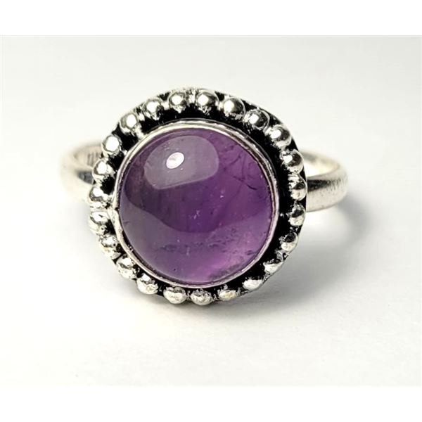 24)  ROUND SIZE 8 AMETHYST RING WITH BEAD