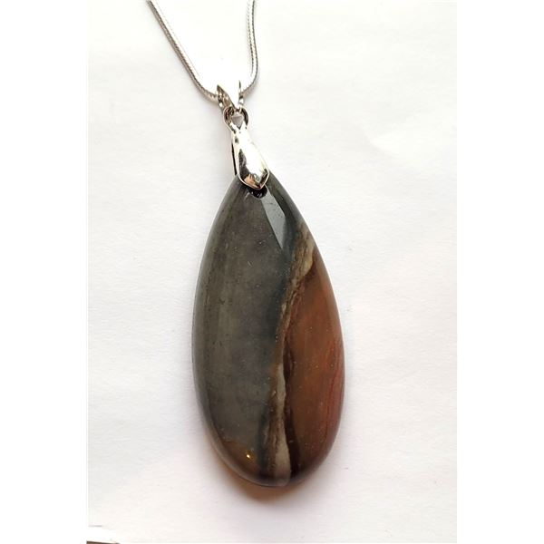 23)  ELONGATED POLYCHROME JASPER PENDANT ON