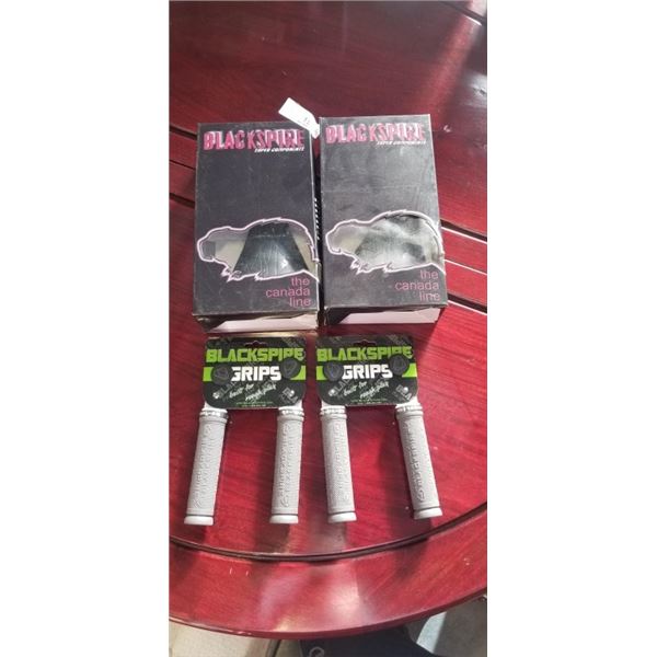 2 NEW BLACKSPIRE BIKE SEATS AND 2 SETS OF BLACKSPIRE GRIPS
