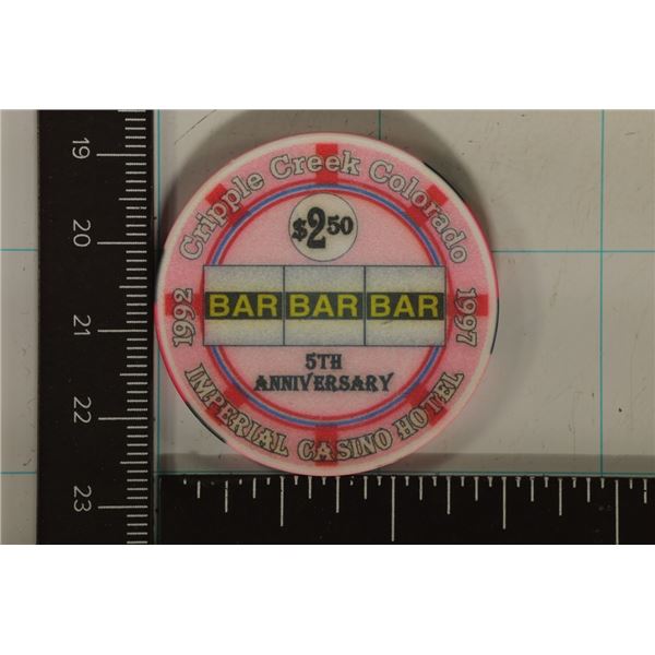 $2.50 IMPERIAL CASINO CHIP. 1992 5TH ANNIVERSARY