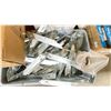 Image 2 : TABLE BOTTOM OF ASSORTED CASTERS, DOOR LEVERS, PIPE HOOKS, BRACKETS & CABLE *BINS INCLUDED*