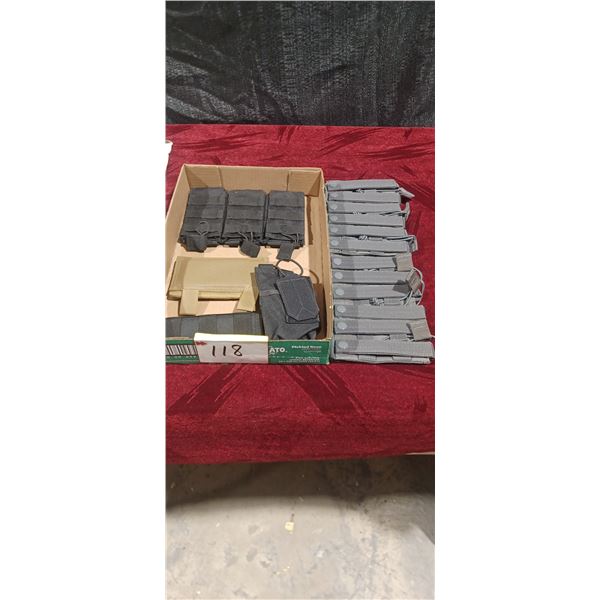 CONTAINER WITH ASSORTED POUCHES, STRAPS, AND AMO CLIP HOLDER