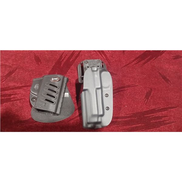 TWO PVC HOLSTERS