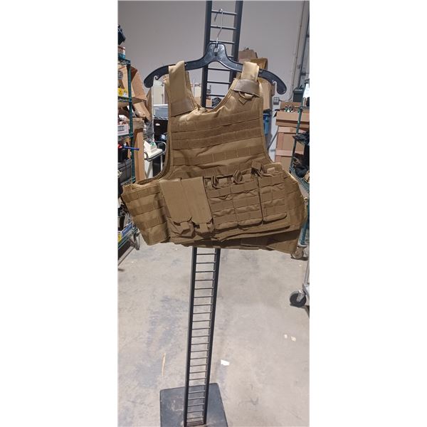 TAN TACTICAL BODY ARMOR CARRIER VEST COMES WITH BULLET PROOF PLATE COMPARTMENTS. PLATE SOLD SEPARAT