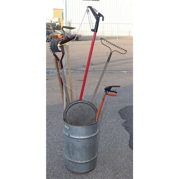 METAL DRUM FULL OF GARDENING TOOLS, RAKES, ECT