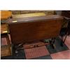 Image 1 : ANTIQUE SOLID WOOD ROLLING DINING TABLE