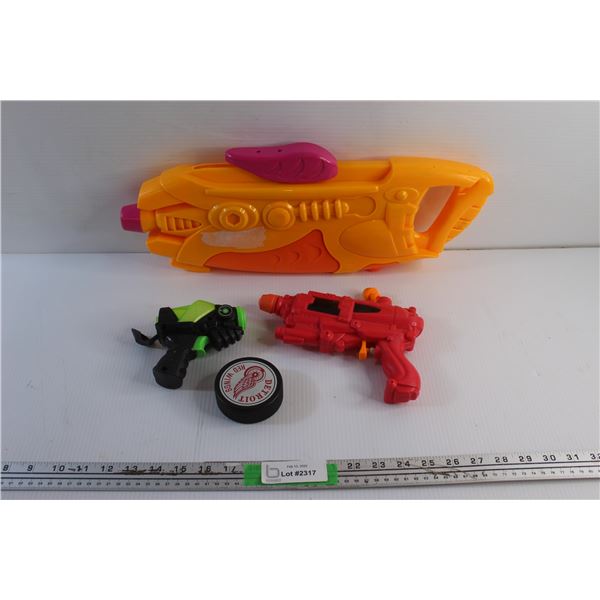 (3) Water Guns and Hockey Puck
