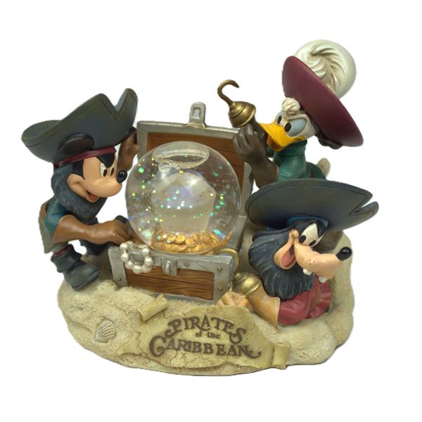 A Disney Parks Pirates of the Caribbean Snow Globe.