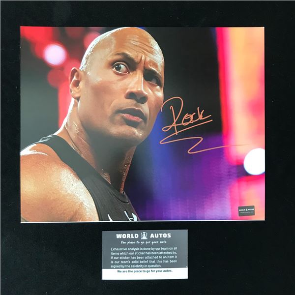 DWAYNE "THE ROCK" JOHNSON SIGNED WWE 8X10 PHOTO (WORLD AUTOS COA)