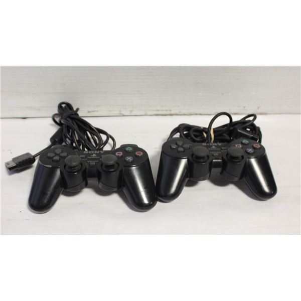 2 X PS 2 DUAL SHOCK 2 REMOTES