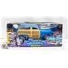 Image 1 : MUSCLE MACHINE 50 FORD WOODY 1/18 SCALE