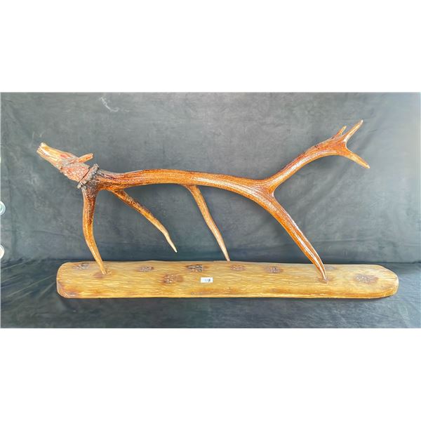 HAND CARVED FIRST NATIONS WOLF CARVED INTO ELK ANTLER ON CEDAR BASE BY CREE ARTIST DUANO GOULET