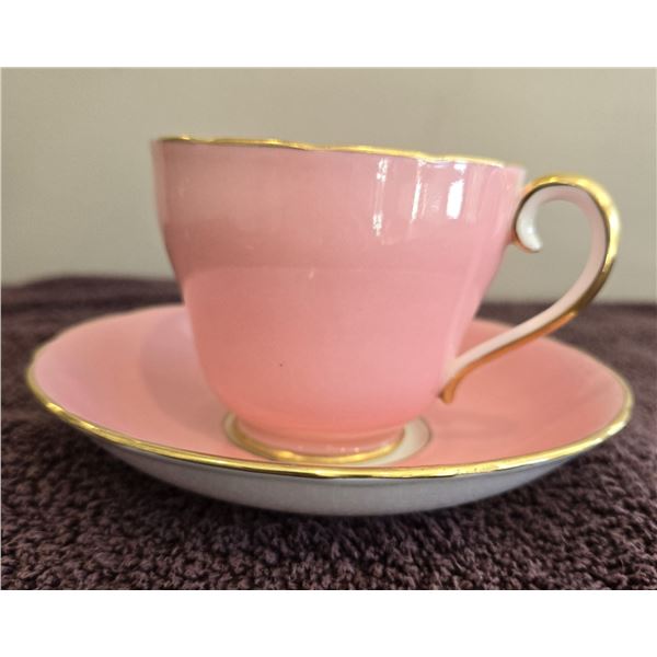 Adderly cotton candy pink teacup and saucer with gold handle and trim. No chips or cracks