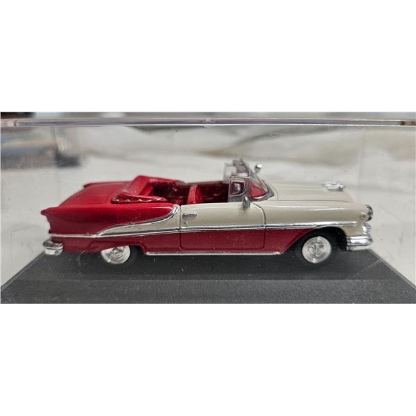 Red 1955 Oldsmobile Super 88 diecast model in case