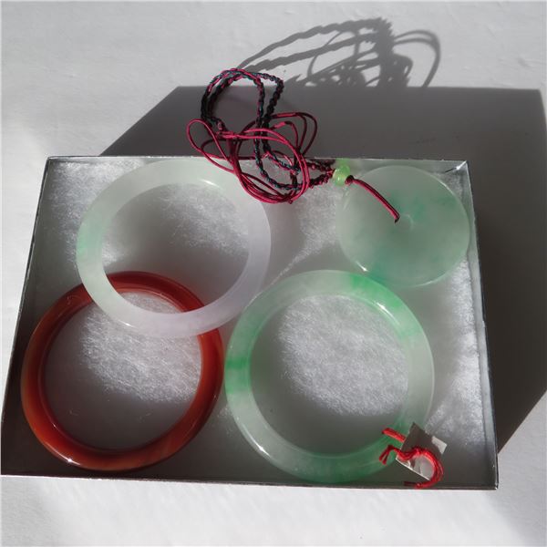 Jade Jewelery lot.  Includes 3 bangle bracelets and a large pendant on a cord necklace