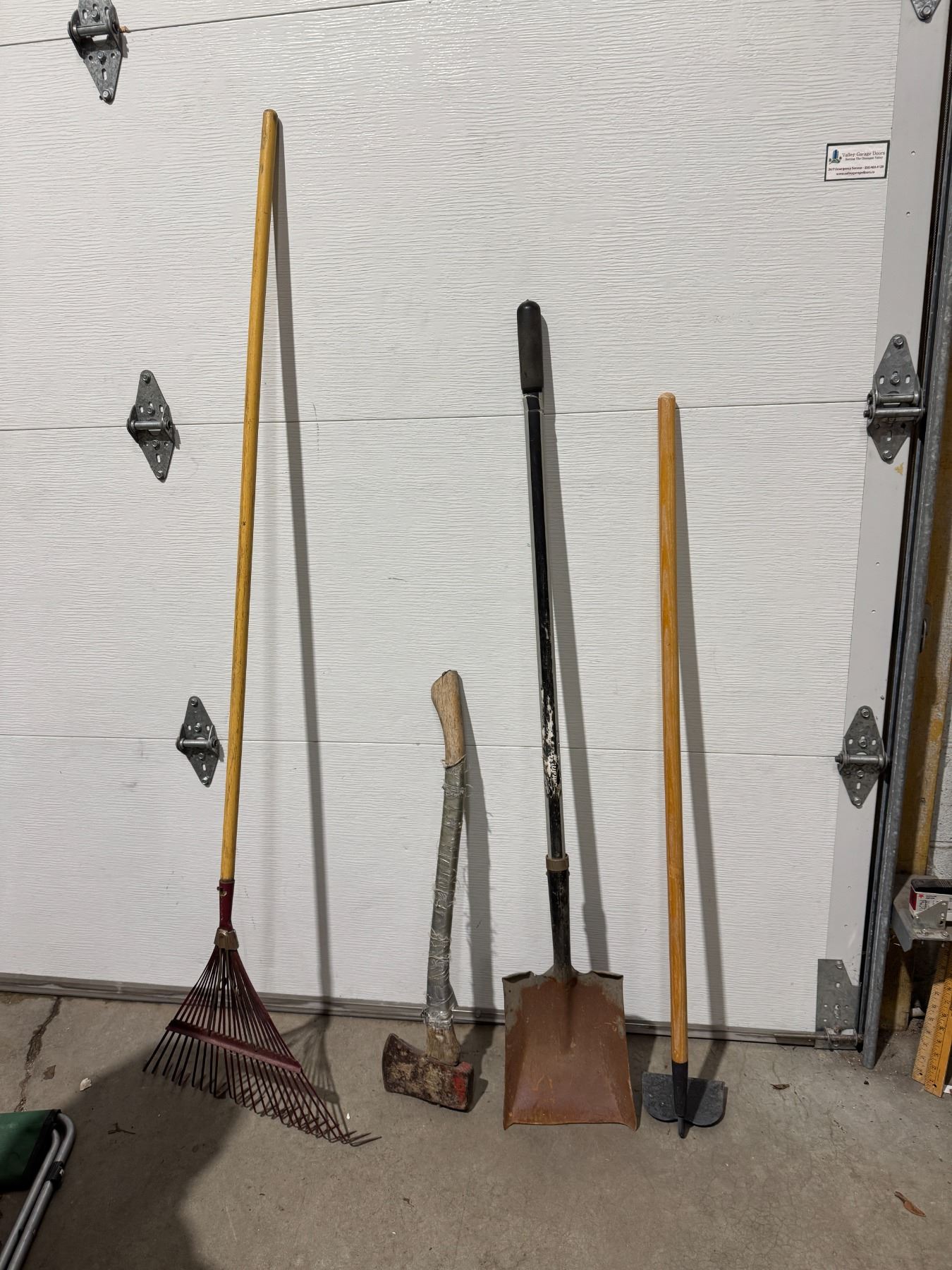 Shovel hoe, ax, and rake