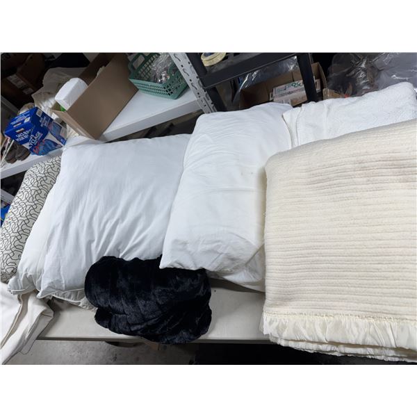 Assorted bedding and pillows