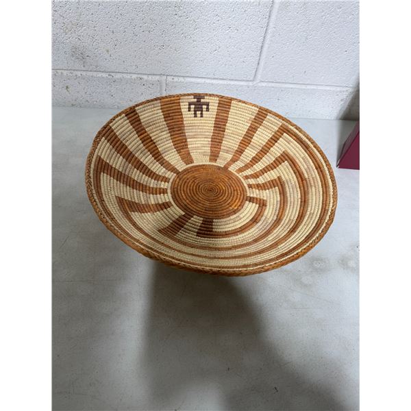 Native American man in the maze basket