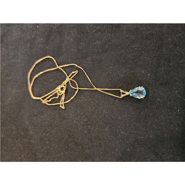 14k Blue topaz pendant with chains- estimated weight 2.07ct
