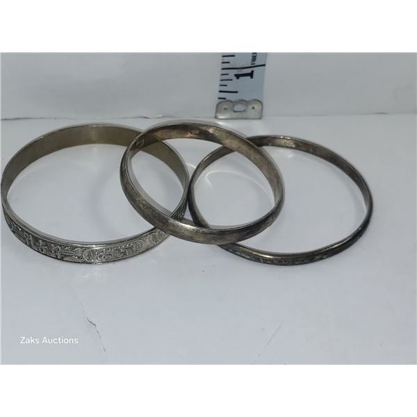 Approximately 2 OZ of Silver Bracelets