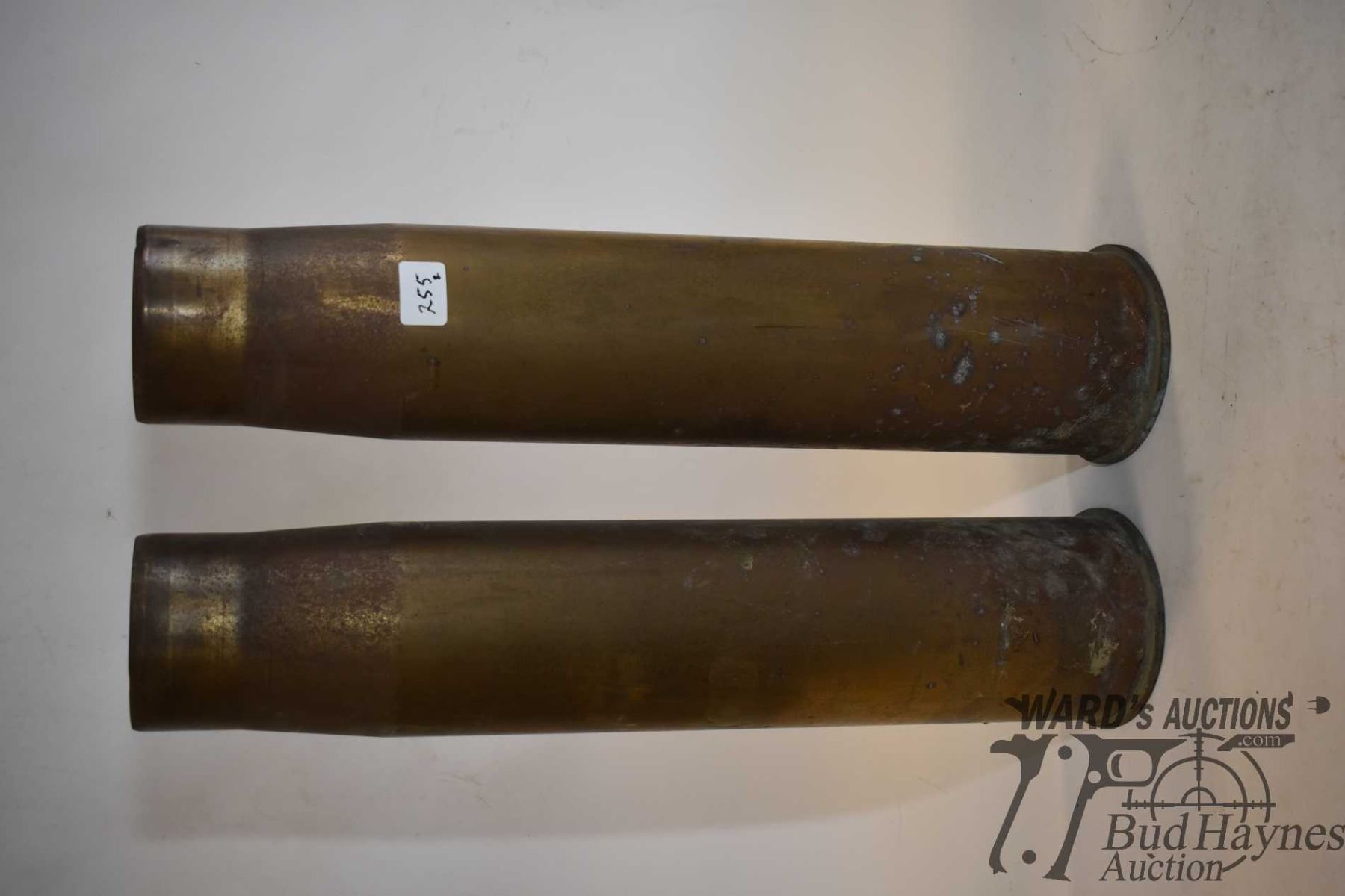 Two large shell casings marked