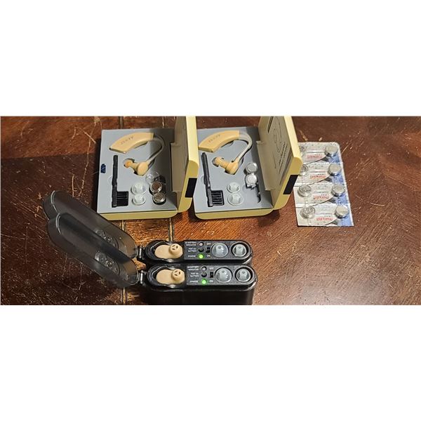 TWO SETS OF HEARING AIDS