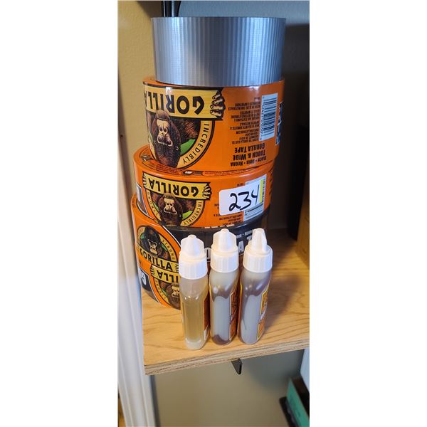 FOUR ROLLS OF GORILA TAPE AND THREE TUBES OF GLUE