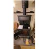 NEAR NEW WOOD BURNING STOVE - COMES WITH TWO BUCKETS, WOOD RACK, POKER, HEAT POWERED FAN. BUER MUST 