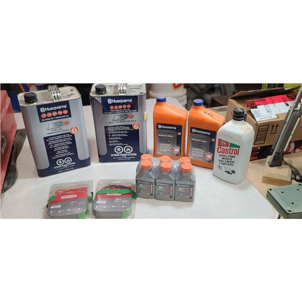 TWO CANS OF PR-MIX FUEL, TWO CHAIN OIL, AND 2 STROKE OIL AND TWO CHAINS