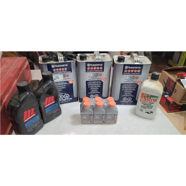 THREE CANS OF PR-MIX FUEL, TWO CHAIN OIL, AND 2 STROKE OIL AND TWO CHAINS