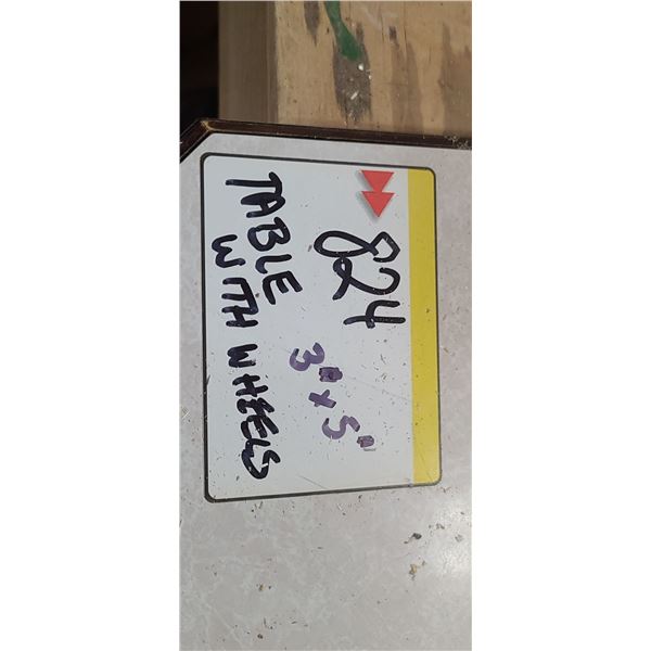 WORK TABLE ON WHEEL 3' X 5' - REMOVE ON LAST DAY AS GARAGE DOOR IS BLOCKED