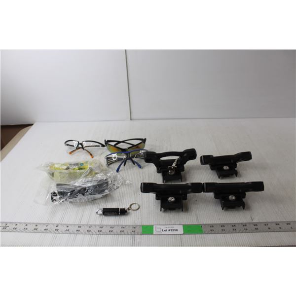 (4) Truck bed Cleats, (5) Safety Glasses, Keychain Light