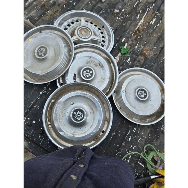 5 hub caps with some dents