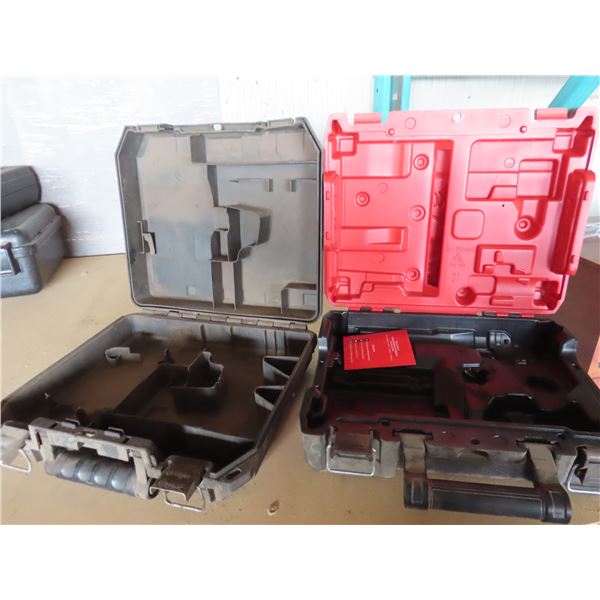 empty Dewalt case and a empty Milwaukee case