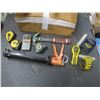 Image 2 : caulking gun, hammer, measuring tapes, laser level, stud finder