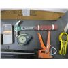 Image 4 : caulking gun, hammer, measuring tapes, laser level, stud finder