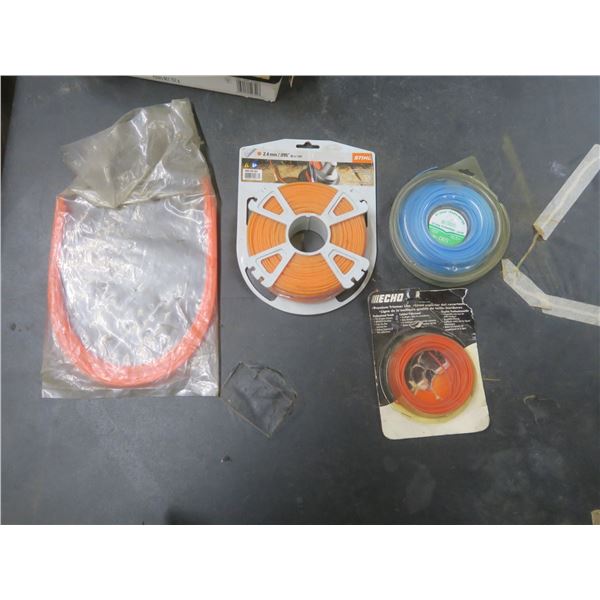 four packages of weed whacker line