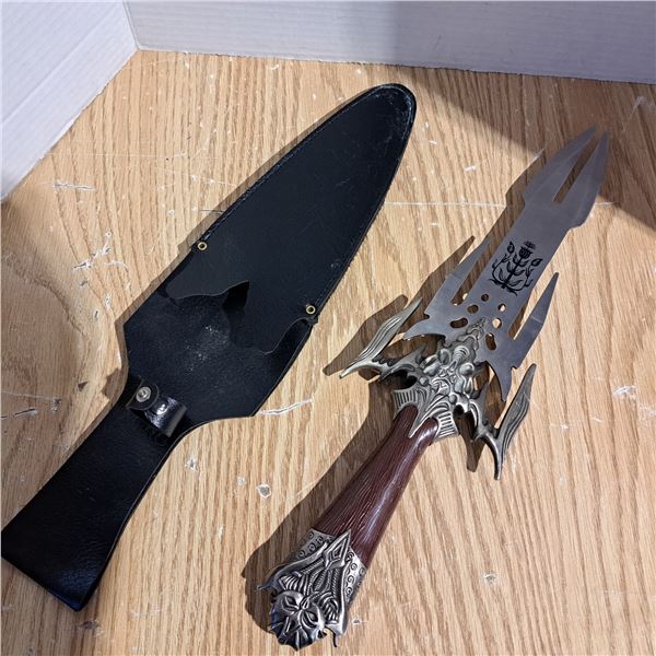 Dagger blunt sides with a sharp end and plastic handle