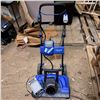 Image 1 : Small blue snow blower with battery charger