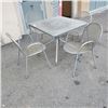 Image 1 : PATIO TABLE AND 4 METAL CHAIRS