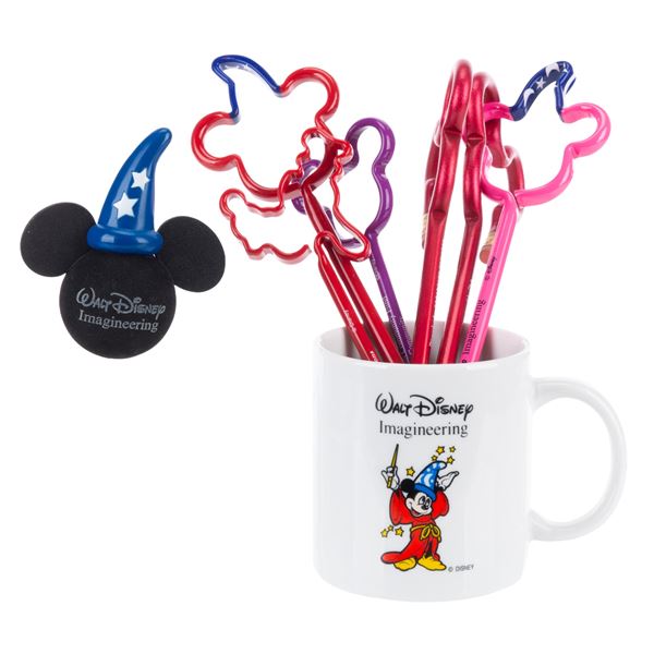 A Walt Disney Imagineering Mug, Pens, Pencils, & Antennae Topper.