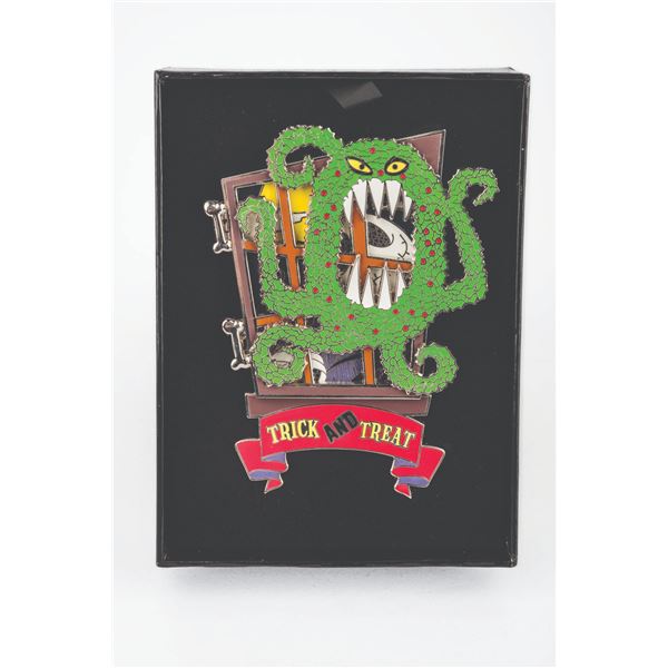 A Disney’s Haunted Mansion Trick and Treat Jumbo Pin.