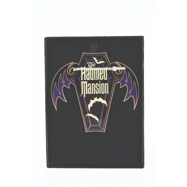 A Disney’s Featured Artist Haunted Mansion Coffin Pin.