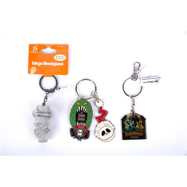 A Collection of 3 Haunted Mansion Keychains.
