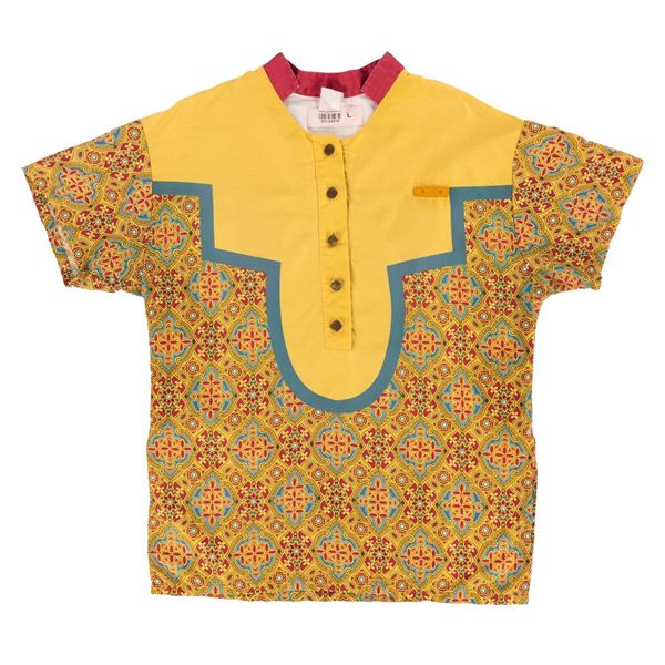 A Walt Disney World Magic Carpets of Aladdin Cast Member Shirt.