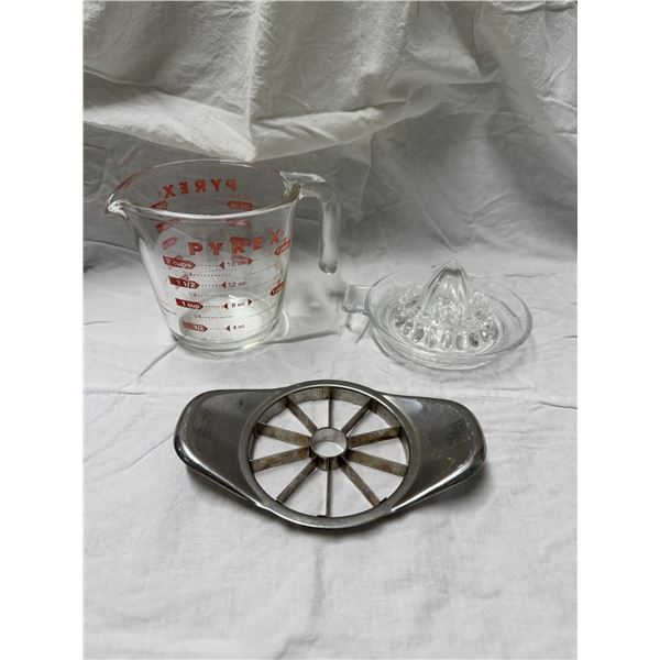 Pirates glass, measuring cup glass, juicer, and pampered chef citrus cutter