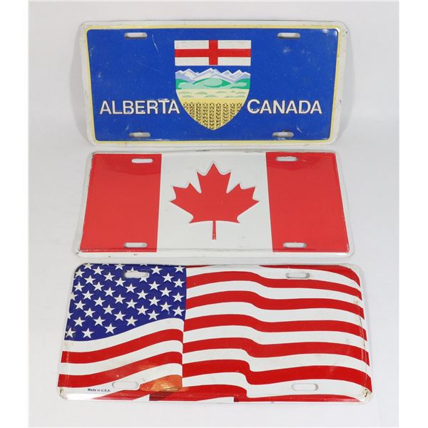THREE PATRIOTIC LICENSE PLATES(USED) USA, ALBERTA,